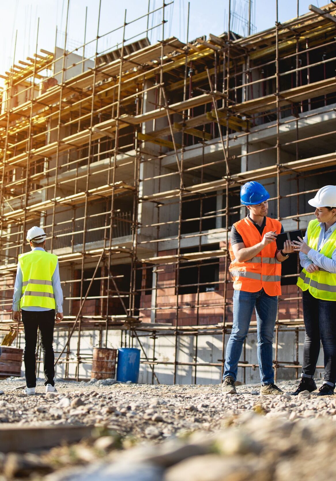 Four construction workers having meeting,stock photo
